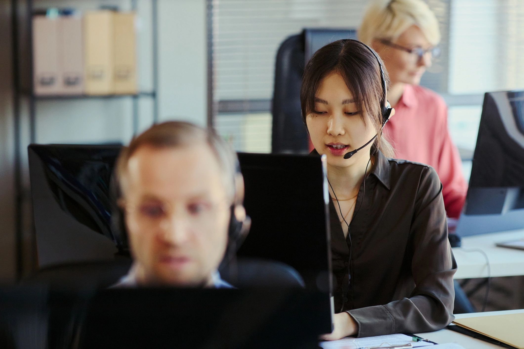 Call center professional supporting customers with headset